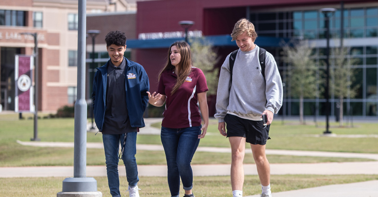 A group of students walking across campus.