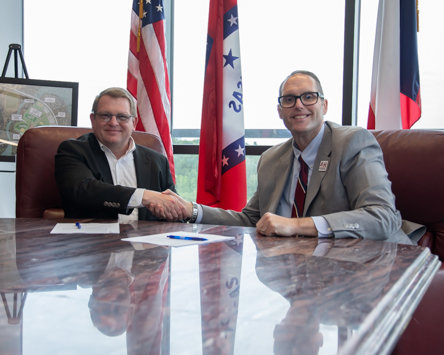 JCM Industries CEO John Collins (left) and A&M-Texarkana President Dr. Ross Alexander signed a new academic partnership giving discounted tuition to full-time JCM employees.