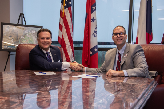 TSD Logistics President and CEO Ryan Berry (a TAMUT alumnus) and A&M-Texarkana President Dr. Ross Alexander sign an academic partnership between the university and the company giving TSD employees discounted tuition at the university.