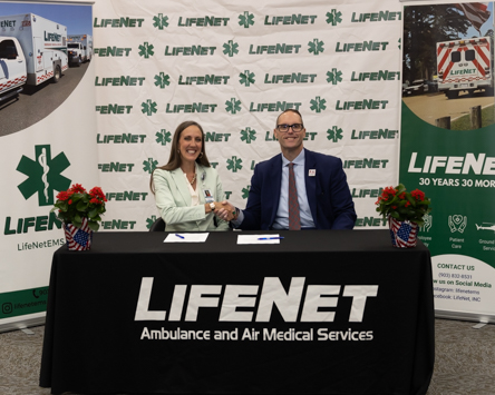 Photo: Alyssa Haley, LifeNet CEO (left) and Dr. Ross Alexander, A&M-Texarkana President sign a memorandum of understanding establishing a partnership between the university and the emergency medical services provider. LifeNet employees are now eligible to take courses at the university with reduced tuition rates.
