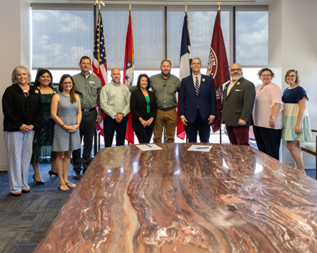 Photo: Representatives from Commercial National Bank and Texas A&M University-Texarkana gathered to sign a memorandum of understanding between the financial institution and the university. The new partnership allows CNB employees to take courses at the university at reduced costs.