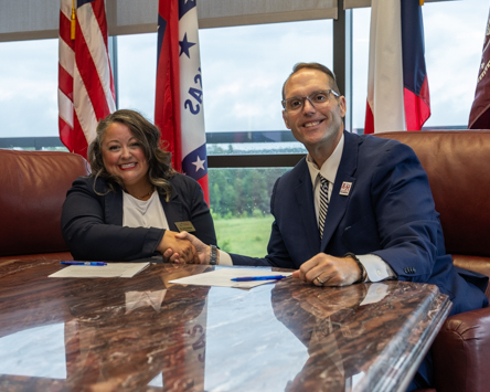 Dr Jenny Walker, Executive Director of Literacy Texas and A&M-Texarkana President Dr. Ross Alexander sign an agreement that creates a partnership between Literacy Texas and the University. The new partnership allows Literacy Texas members to receive discounted tuition on courses at A&M-Texarkana.