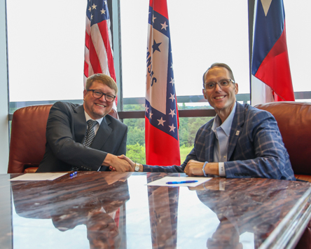 L.J. Henson, Scout Executive and CEO of the Caddo Area Council and Dr. Ross Alexander, President of A&M-Texarkana sign a partnership agreement that provides Caddo Area Council employees discounted tuition at the university.